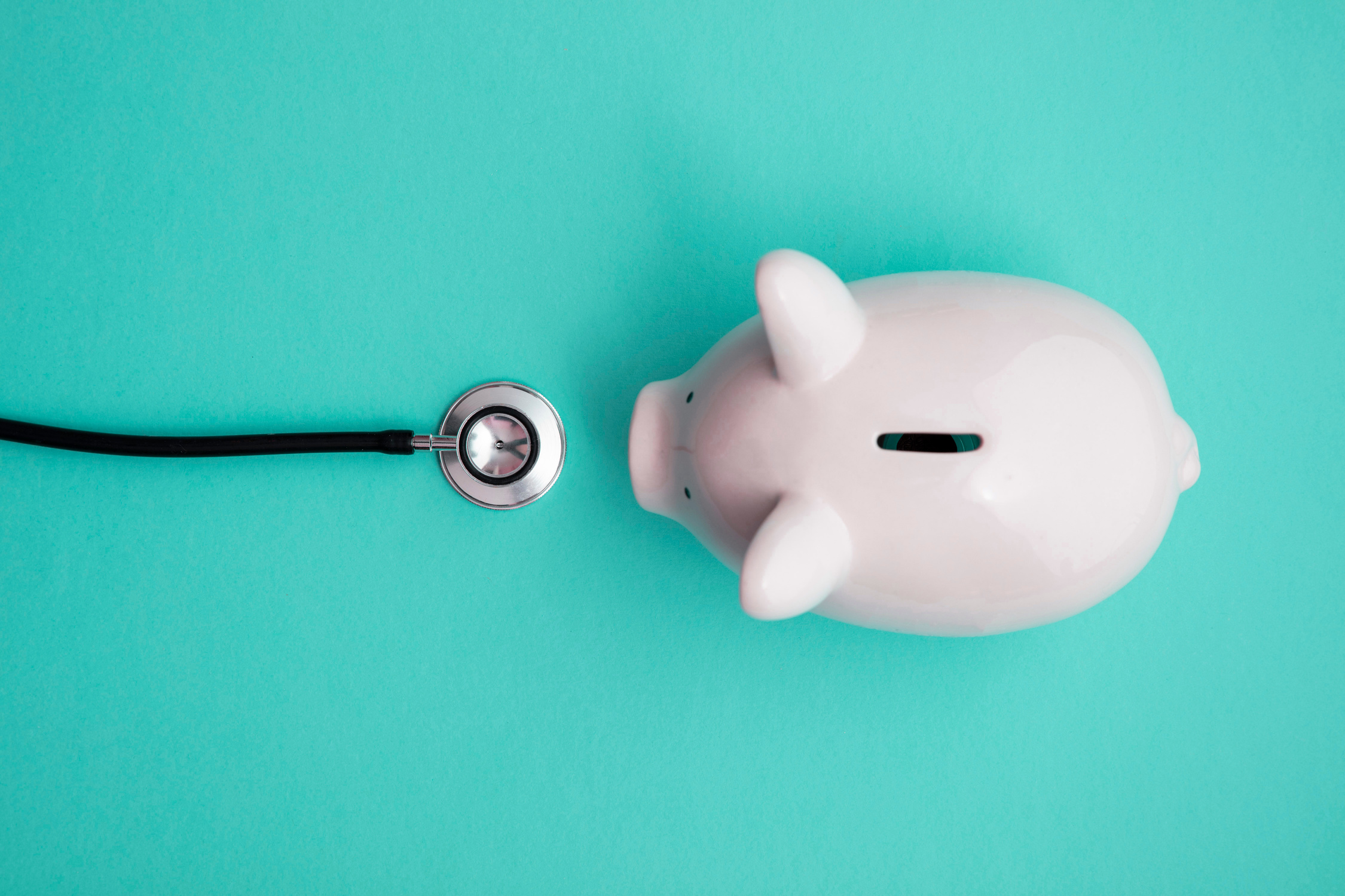 Top View of Piggybank and Stethoscope for Financial Concept